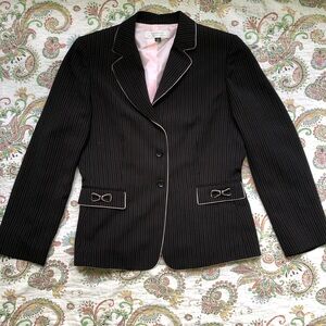 Black pinstripe babydoll blazer with pink bow details and shoulder pads